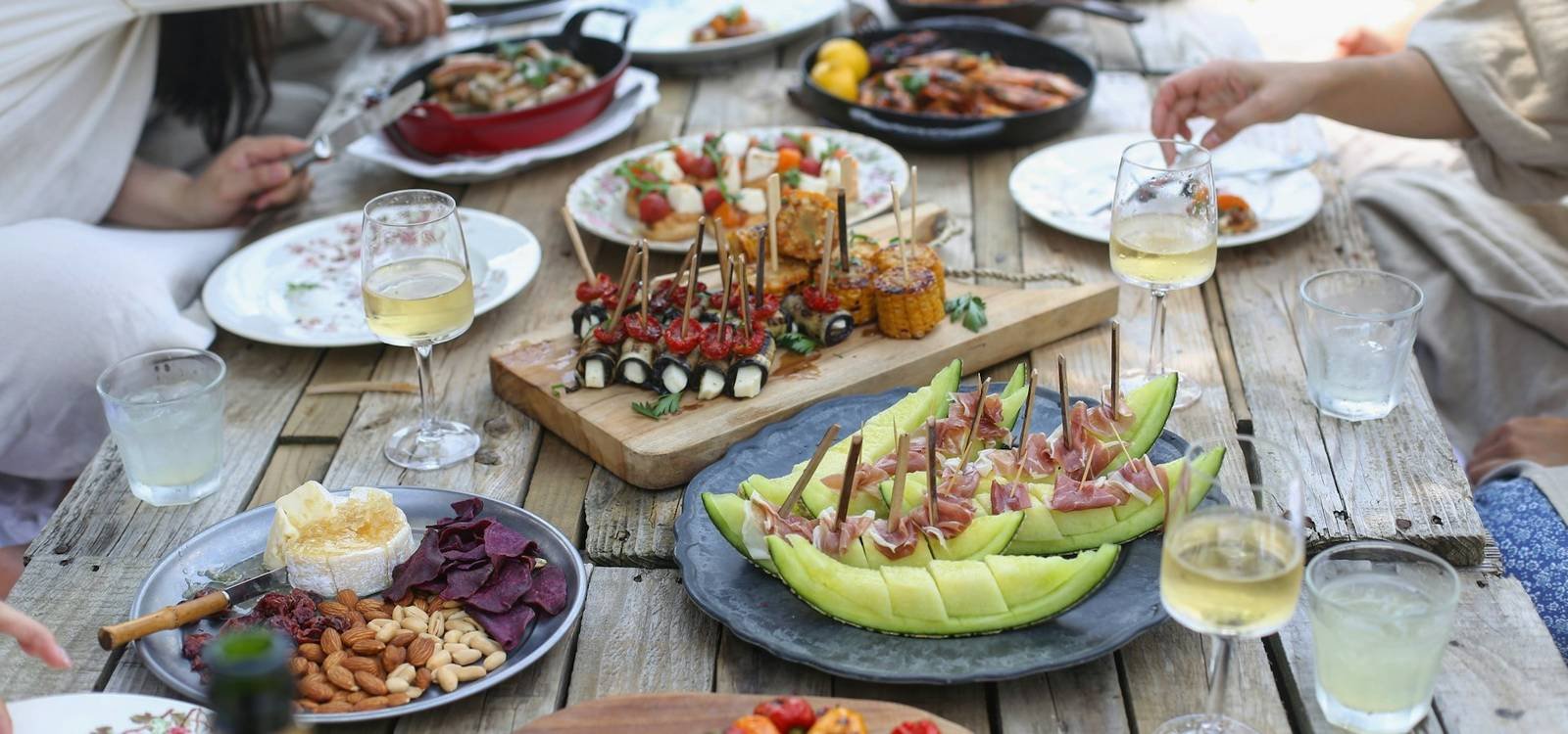 Family and friends sharing a meal at an outdoor table