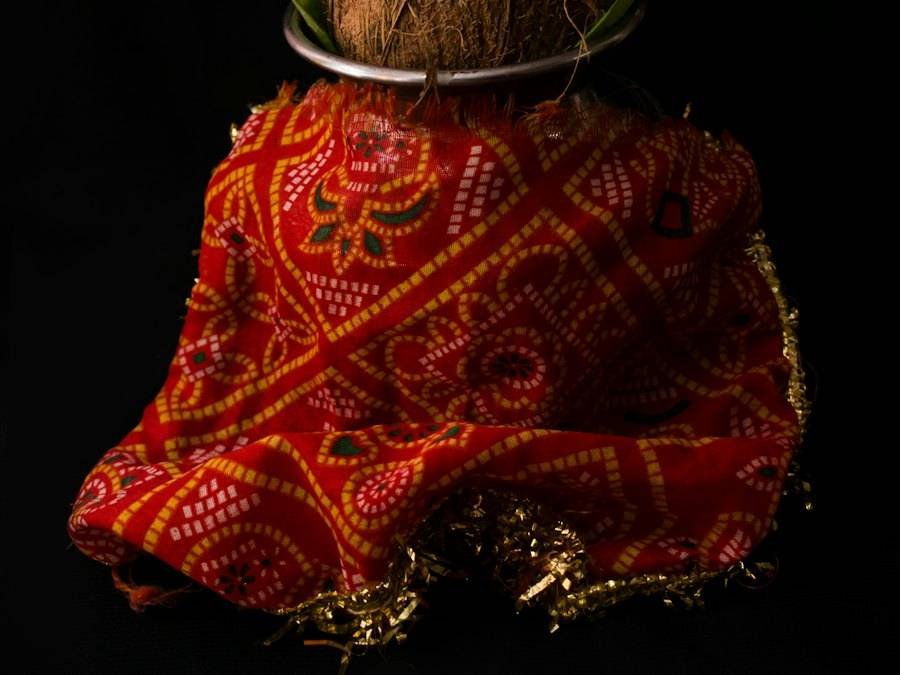 A festive kalash dressed in red and gold cloth